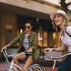 a two women riding bikes