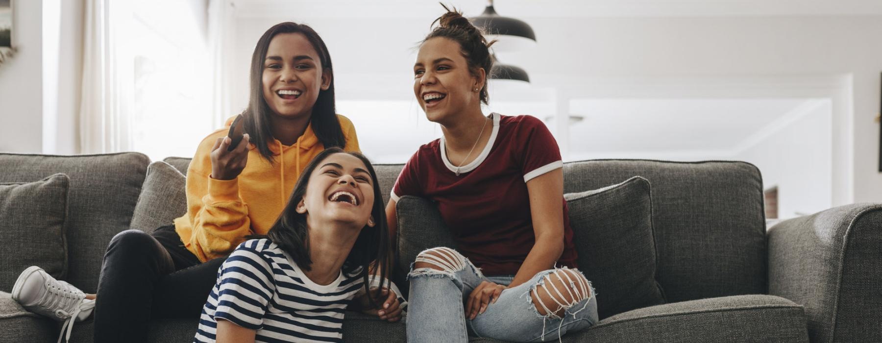 a group of women sitting on a couch